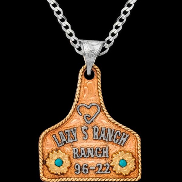 Introducing the Penny Cow Tag Necklace featuring a copper base adorned with  bronze rope edge and flowers. Personalize it with 3 lines of text and back engraving. Pair it with a special discount sterling silver chain!